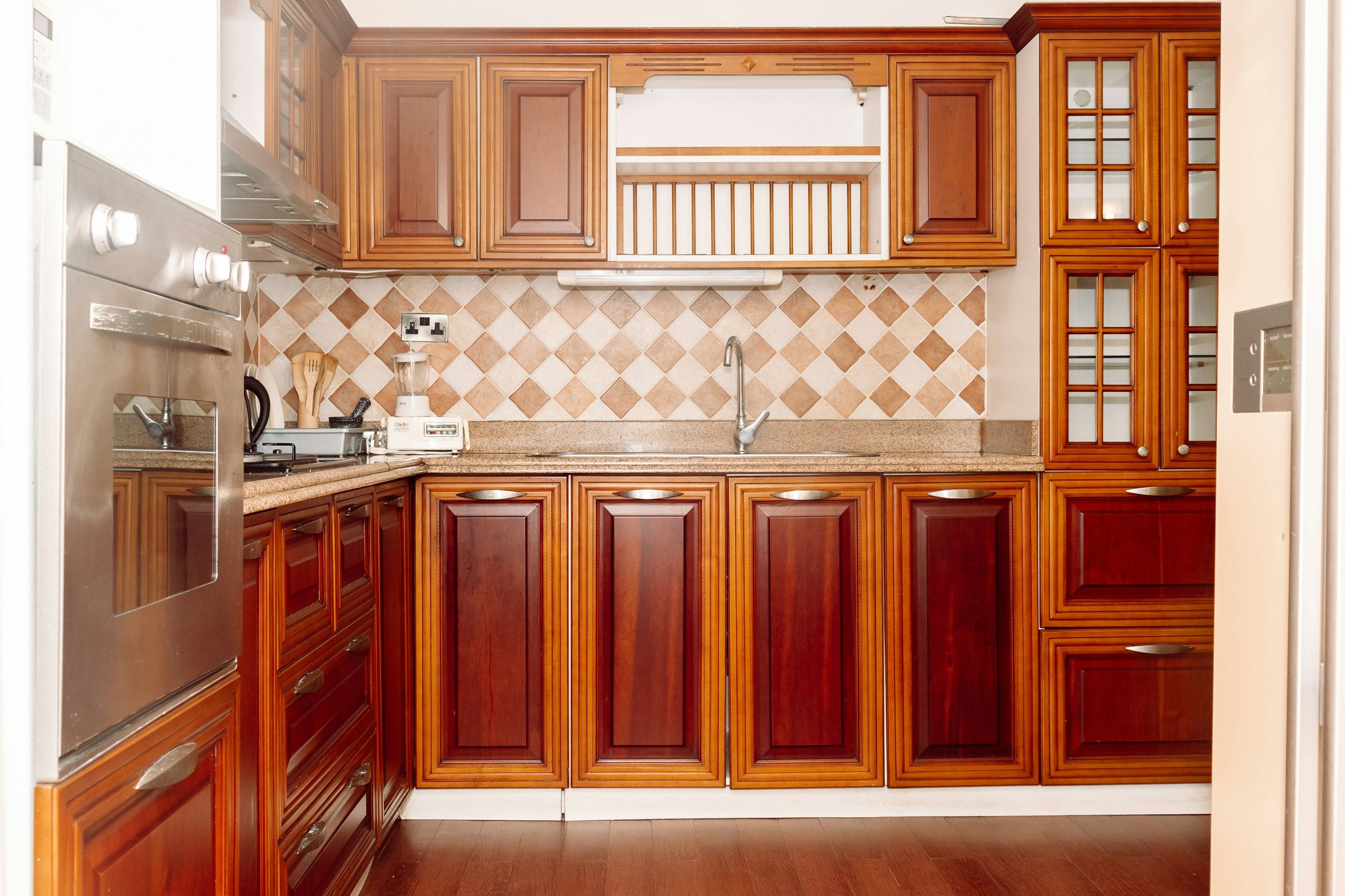 Kitchen with wood cabinets and a tiled backsplash
